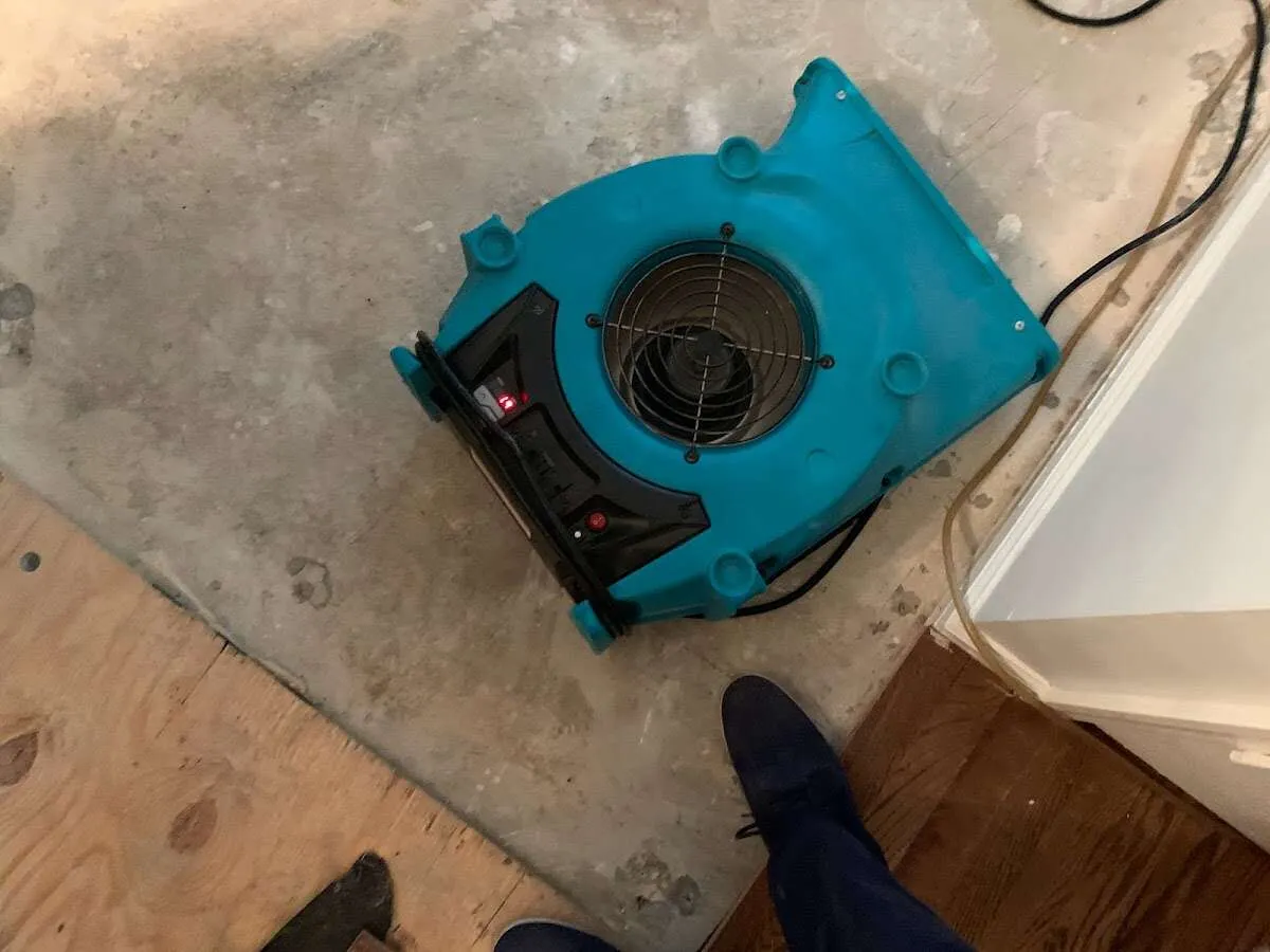 Air mover drying subfloor during Commercial Water Damage Restoration in Lugoff